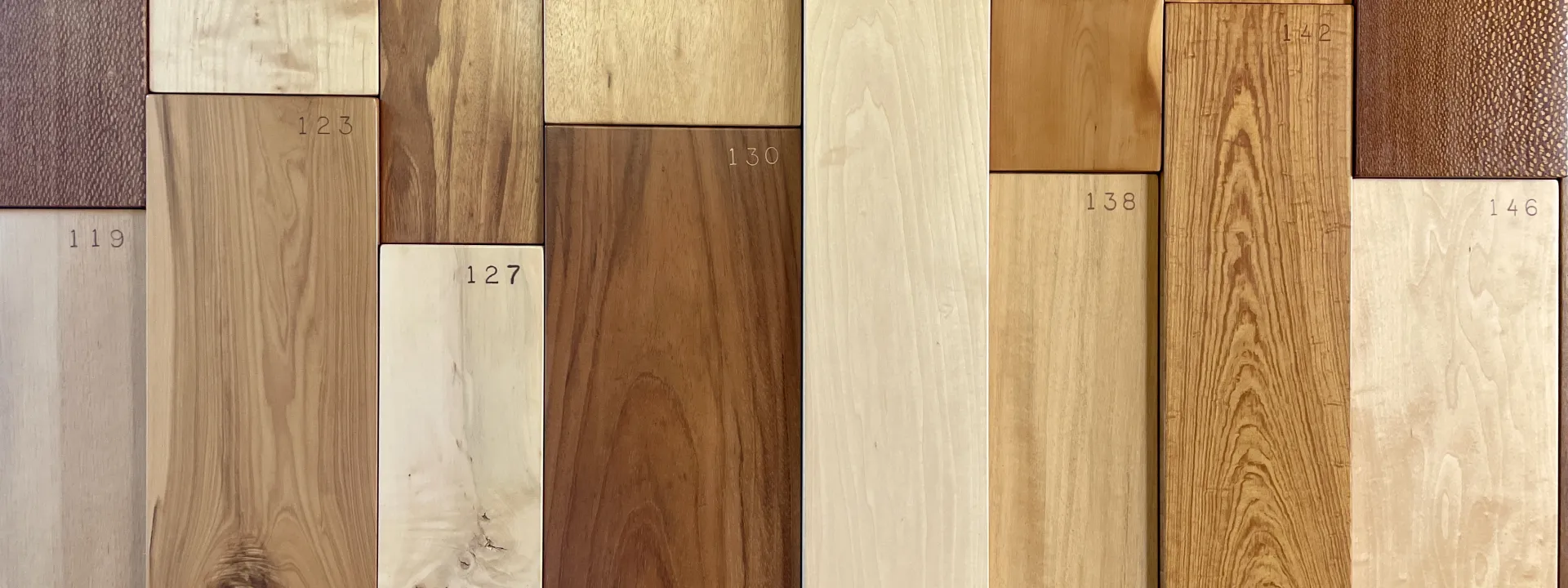 Small panels of different types of wood on display.